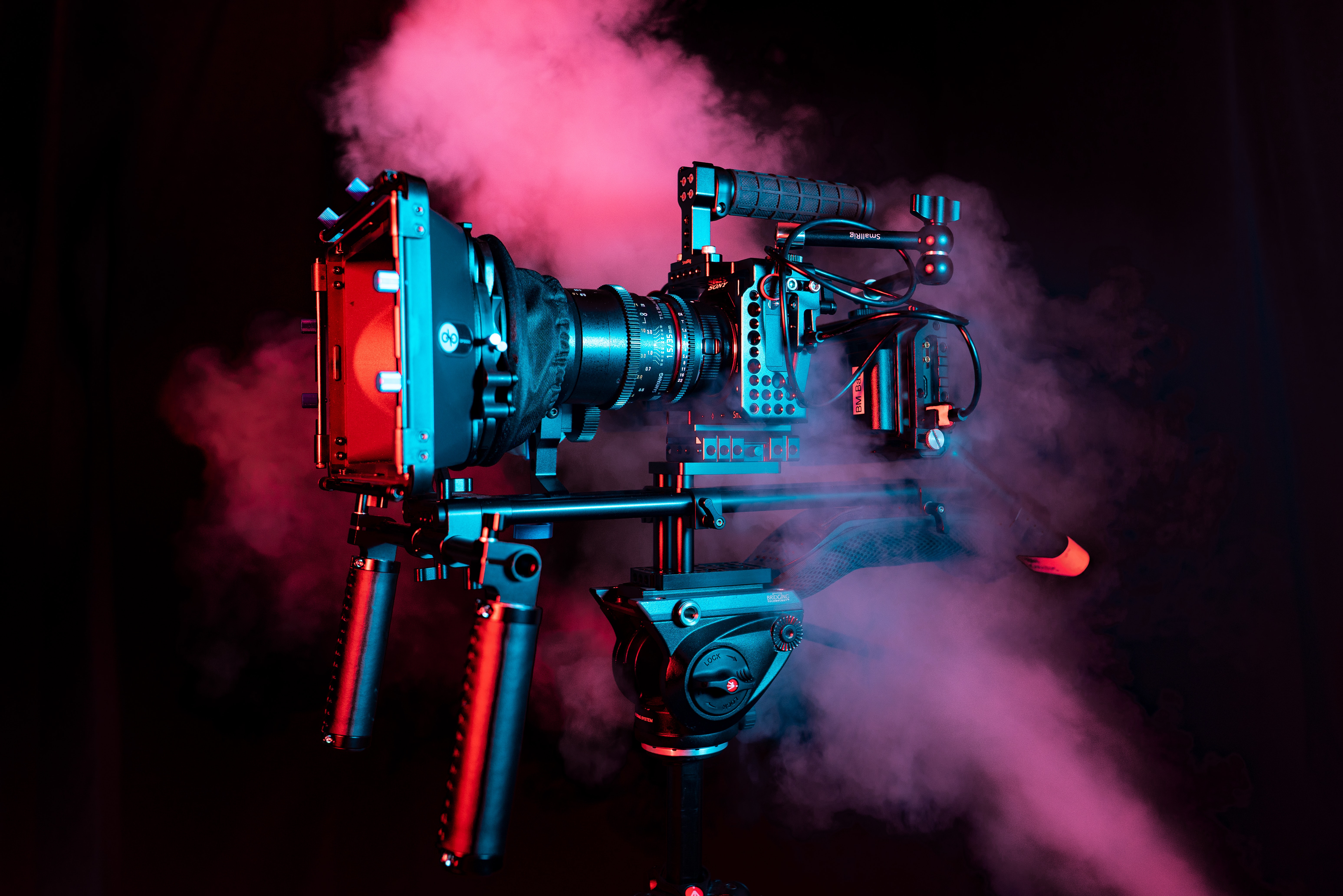 A camera rig with a red light on top of it.